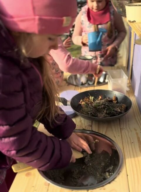 A close look at a handcrafted wooden mud kitchen during play